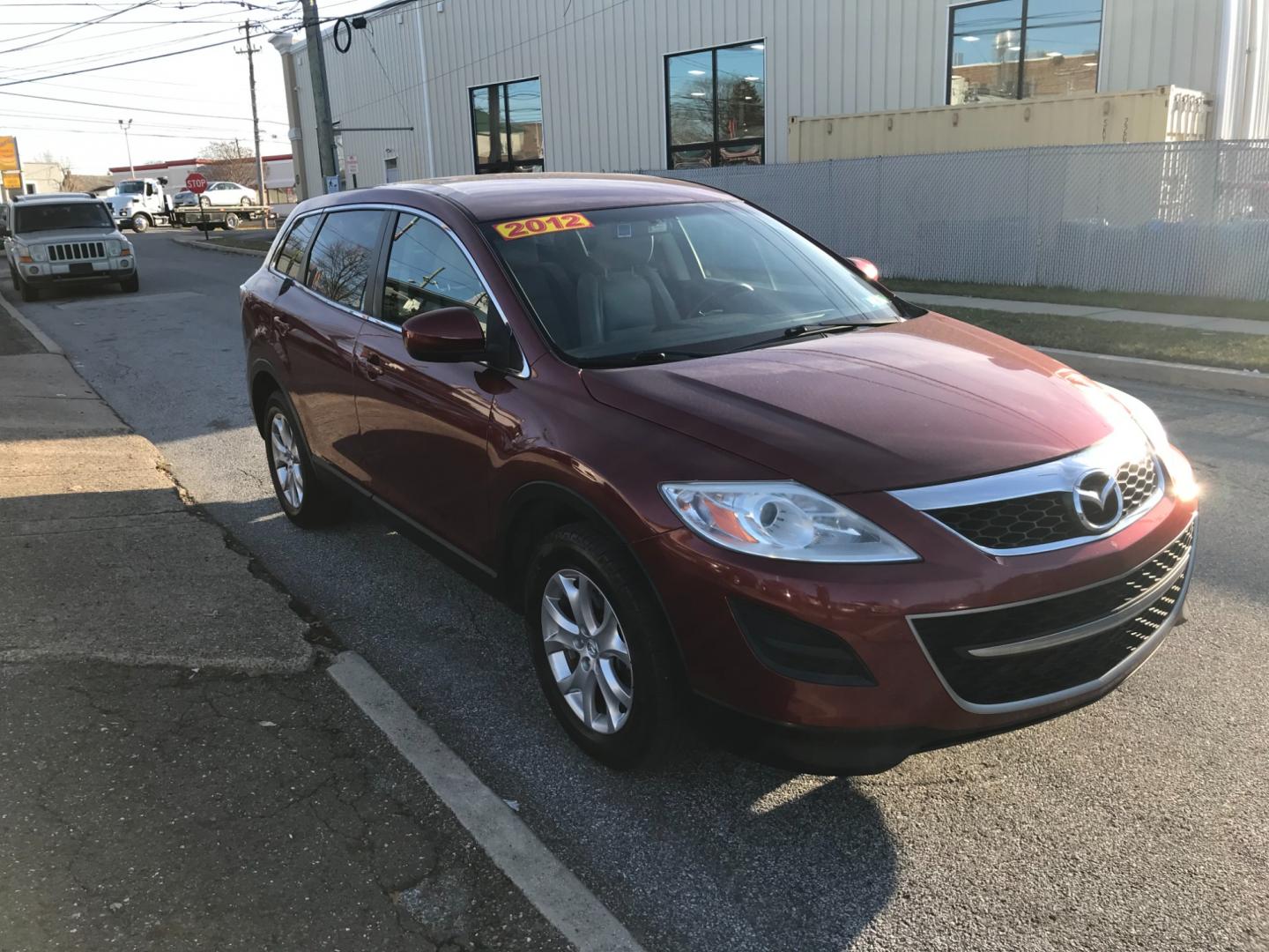 2012 Red /Tan Mazda CX-9 Touring (JM3TB3CV5C0) with an 3.7 V6 engine, Automatic transmission, located at 577 Chester Pike, Prospect Park, PA, 19076, (610) 237-1015, 39.886154, -75.302338 - Photo#3